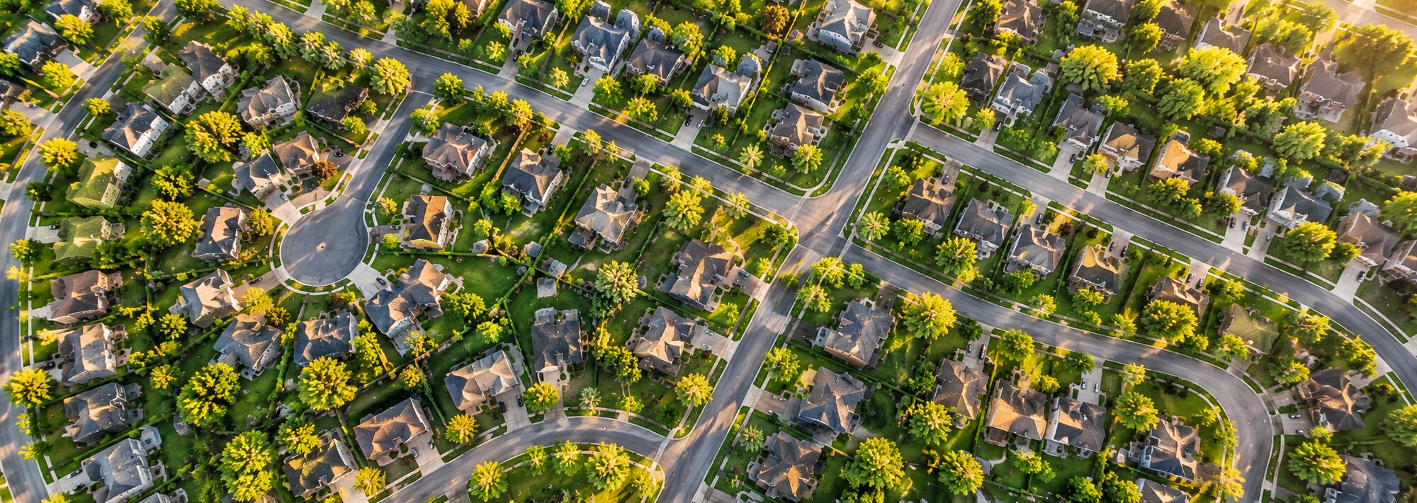 Aerial view of a neighborhood at sunset