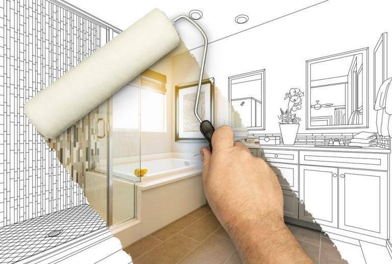 Hand using a paint roller revealing a finished bathroom behind a sketch, showing remodeling concept.