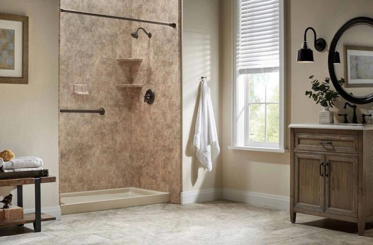 Bathroom with shower stall, vanity, and window with blinds. Beige and brown tones.